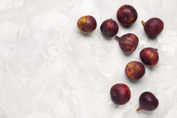 Fresh ripe figs on grey background