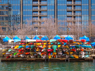 Canoes on winter storage racks waiting to be put back into the water in spring, located on the shore of Lake Ontario in downtown Toronto.