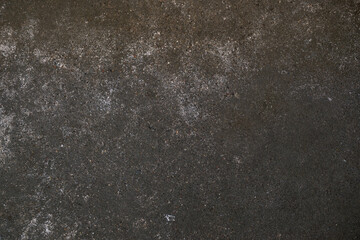 Dark gray concrete surface as grunge background texture for urban themes like subculture,...