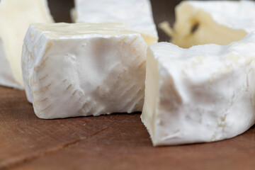delicious white cheese sliced on a board