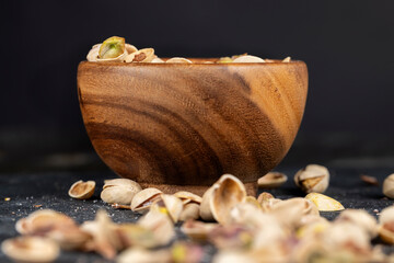 a large number of salty and crispy pistachios close-up