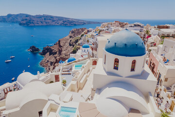 Aerial view of the Aegean Sea and the Blue Dome Church on the island of Santorini, Greece.