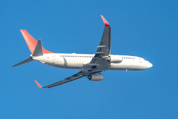 White passenger plane taking off