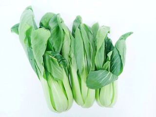 fresh green vegetables. Pakcoy or Bok choy or spoon mustard greens (Brassica rapa subsp. chinensis). Popular green vegetables on white background.