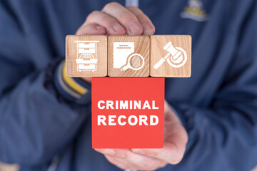 Businessman holding colorful blocks sees inscription: CRIMINAL RECORD. Concept of criminal records.