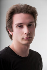 Fototapeta premium Young man's gaze suggests deep knowledge, opinions