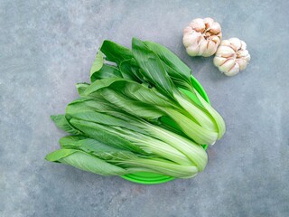 Pakcoy or Bok choy or mustard spoon (Brassica rapa subsp. chinensis). Popular green vegetables. Ingredients for stir fried garlic baby bok choy. Top view