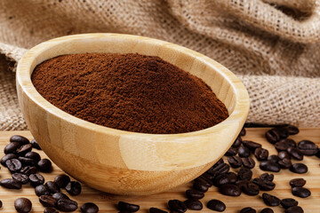 Close up of a wooden bowl of Fresh Ground Coffee