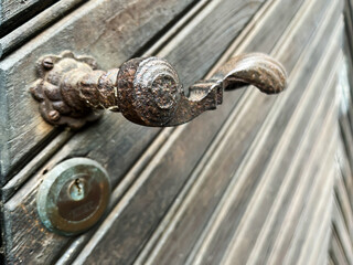Antique Iron Door Handle on an Old Door
