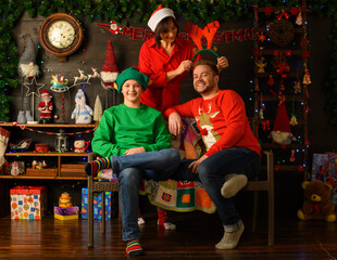 Fototapeta na wymiar happy family in christmas decoration uses tablet