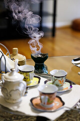 coffee cups with incense burning