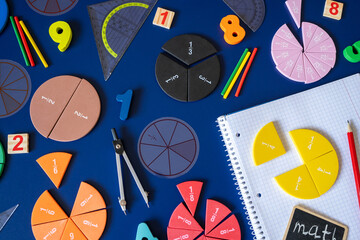 Сolorful math fractions on blue background. interesting math for kids. Education, back to school concept. Geometry, numbers and mathematics materials for preschool or daycare