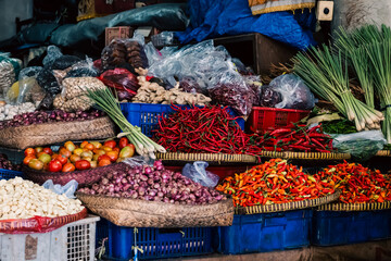 Colorful collection of vegetables, spices, nuts and lemon grass for sale in Pasar Badung, the main Denpasar city market in Bali, Indonesia.
