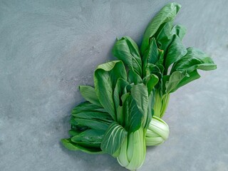 fresh herbs on a table. Pakcoy or Bok choy or spoon mustard greens (Brassica rapa subsp. chinensis). Popular green vegetables.