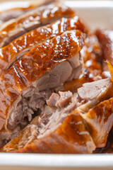 angle view box of roasted goose at vertical composition