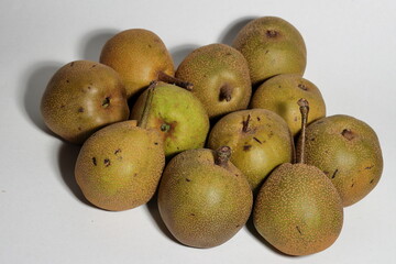 Crispy asian pears for sale in the outdoor farm market. Healthy Asian Pears on white background