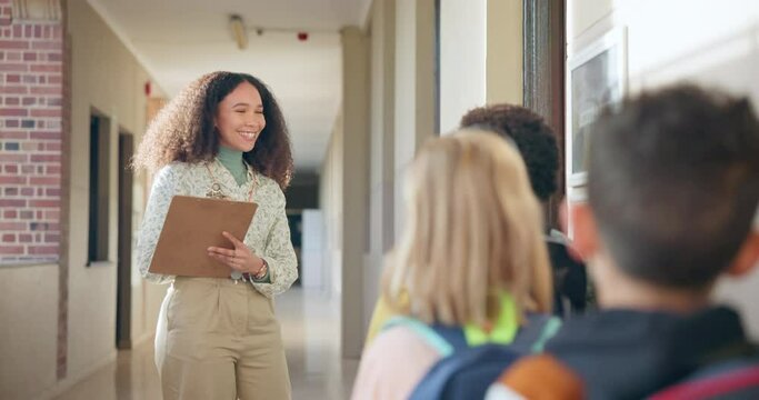 Education, clipboard for attendance and a teacher with students for a head count before class. School, documents and roll call with a woman educator counting children as they enter a classroom