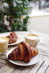 breakfast with croissant and coffee