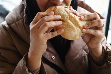 women hand holding beef burger 