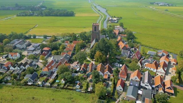 Picturesque Dutch village of Ransdorp in the polder with its church and traditional houses