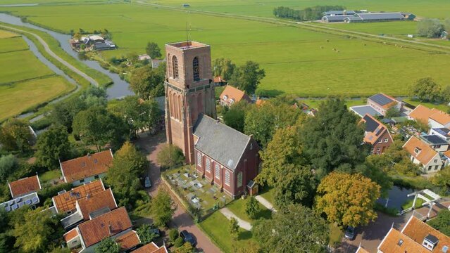 Orbit around the famous church of Dutch village Ransdorp without spire