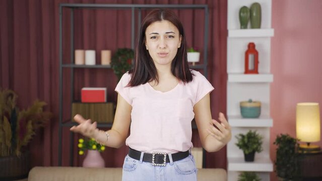 Woman making chatty expressions looking at camera.