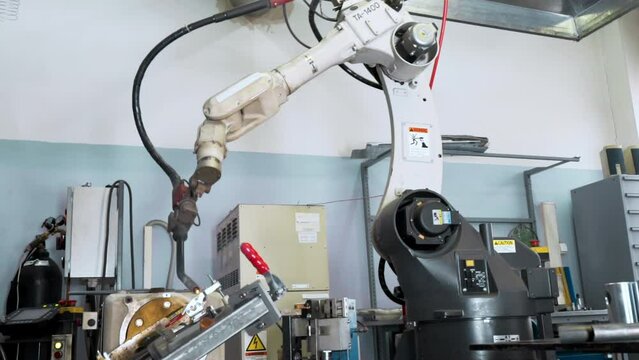 Automated Machine Finished Welding And Returned Back To Default Position. Manufacturing Workshop Technical Welding Machine Finished Treatment Of Product. Welding Machine Finished Production Process