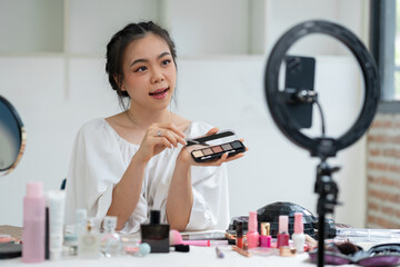 Asian beauty businesswoman live streaming makeup tutorial video clip Live selling cosmetics Perfume...