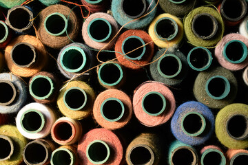 Close up old vintage thread coils multicolored