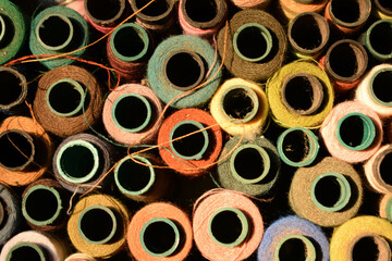 Close up old vintage thread coils multicolored