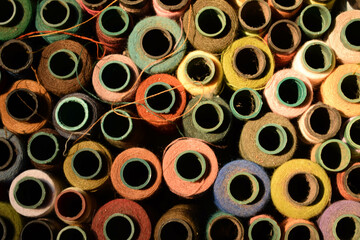 Close up old vintage thread coils multicolored