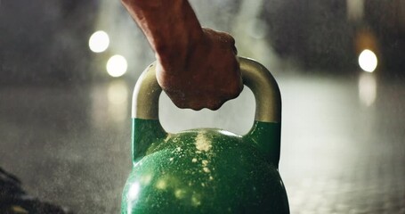 Fitness, training and closeup of hand on kettlebell for weightlifting exercise in a gym. Strength, health and zoom of sports athlete body builder with weight equipment for muscle workout or exercise.