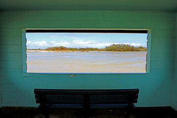 Bench and window with the view of Kanaha Pond Wildlife Sanctuary, Maui, Hawaii