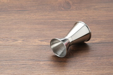 Jigger Measure, metal bar instrument or measuring cup 
