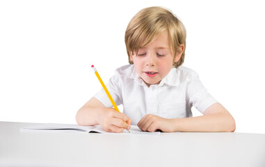 Digital png photo of caucasian schoolboy writing in notebook on transparent background
