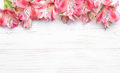 Beautiful Alstroemeria flowers on wooden background