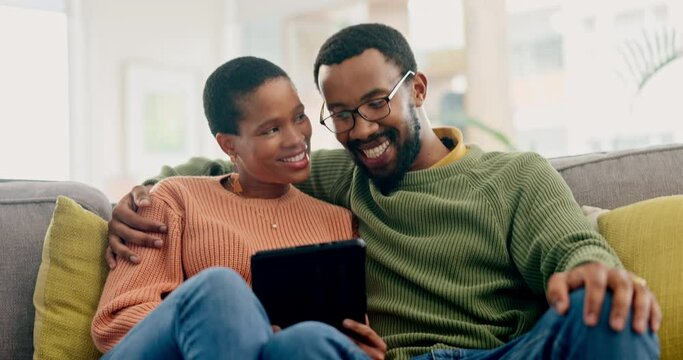 Happy couple, hug and tablet on sofa for streaming, subscription or internet search at home. Love, relax and black woman with man in living room online for social media, movie or bond in a house
