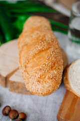 The concept of healthy eating, diet. Sesame bread on the table.