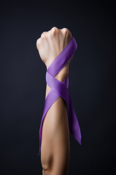 International Day for the Elimination of Violence against Women - Arm with violet ribbon