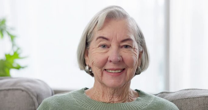 Smile, face and a senior woman on the sofa for relax, comfort and a break in retirement. Happy, living room and portrait of an elderly person in a nursing home for calm, confident and positivity