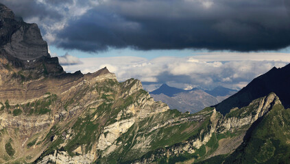 Fototapeta premium Cloud Hanging Over A Mountain Ridge