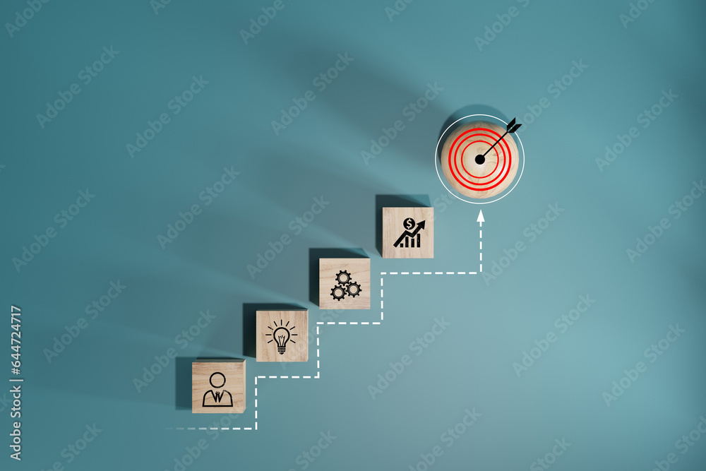 Wall mural woods block step on table with icon action plan, goal and target, success and business target concep