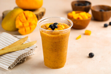 Mango and Blueberry cocktail juice served in glass isolated on table top view of healthy morning drink