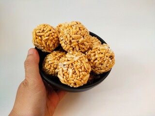 Kue Gipang, Jipang, also named Teng teng Beras one of Indonesian Traditional meal Cereal made from Rice Crispy with Sticky Sugar caramel. Taste Sweet and Crispy, on white background. photo image.