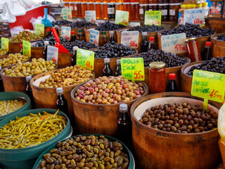Various types of salted and pickled green and black olives at local farmers market, Alanya,...