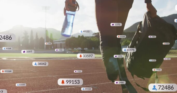 Animation of icons, changing number, african american athlete walking towards race track