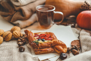 Sweet pastry and cup of tea, good autumn morning concept