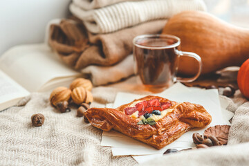Sweet pastry and cup of tea, good autumn morning concept