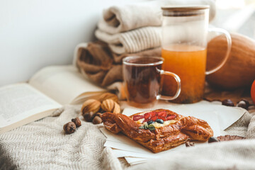Sweet pastry and cup of tea, good autumn morning concept