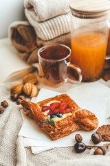 Sweet pastry and cup of tea, good autumn morning concept